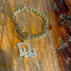 Size 17 gold bracelet. Gold plated material with crystals.